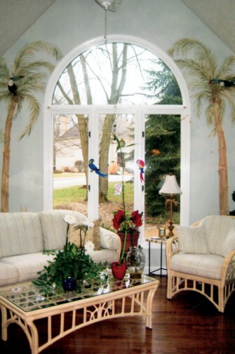 palm trees surrounding arched window