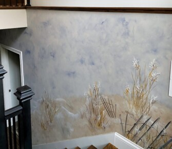 mural of indiana dunes leading to basement